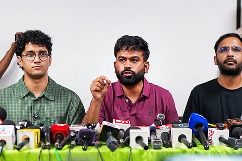 Cockroach Janta Party (CJP) founder Abhijeet Dipke addresses a press conference as Co-conveners Saurav Das, left, and Ashutosh Ranka, right, look on, in New Delhi, Thursday, Sept. 24, 2026.