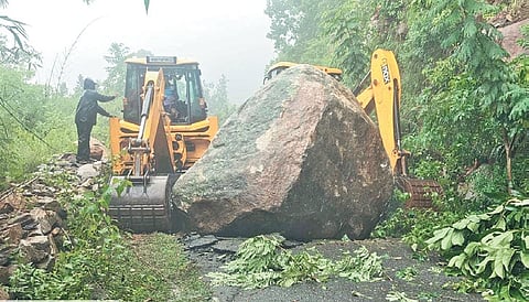 Efforts underway to remove the huge boulder blocking the Tadakasahi-Ankuli road in Ganjam’s Patrapur.