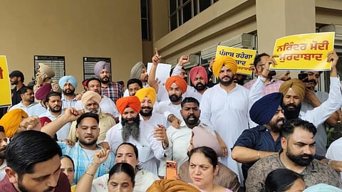 AAP workers protested outside the GMADA office in Mohali, raising slogans against PM Narendra Modi for ‘misusing’ the ED to deter his political opponents