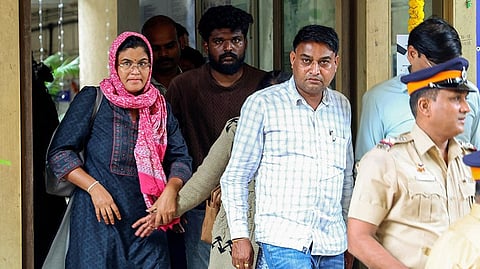 Parents of Sahil Wakode at a police station.
