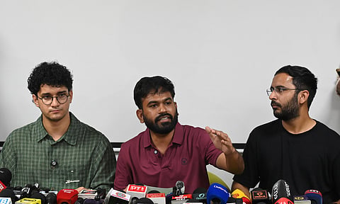 Cockroach Janta Party (CJP) founder Abhijeet Dipke addresses a press conference as Co-conveners Saurav Das, left, and Ashutosh Ranka, right, look on,