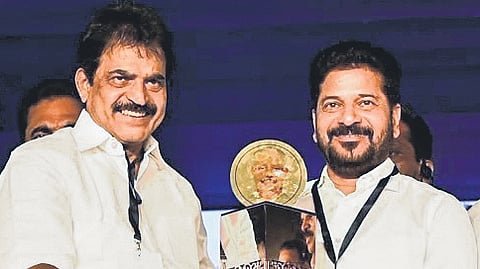 AICC general secretary KC Venugopal presents the Aryadan Muhammed Best Public Servant Award to Chief Minister A Revanth Reddy in Nilambur, Kerala, on Friday