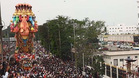 The immersion procession of 69 ft Khairatabad bada Ganesh crosses Telangana state Secretariat in Hyderabad on Friday. 
