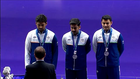 India's Rudrankksh Patil, Aishwary Pratap Singh Tomar and Niraj Kumar during the medal ceremony of the 50m rifle 3 positions team event on Friday