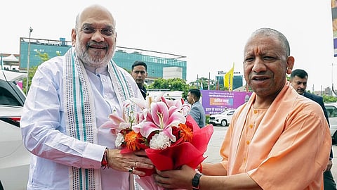 Uttar Pradesh Chief Minister Yogi Adityanath welcomes Union Home and Cooperation Minister Amit Shah on his arrival for the inauguration of the fourth edition of the UP International Trade Show (UPITS 2026) at the India Expo Centre and Mart, in Greater Noida on Friday.
