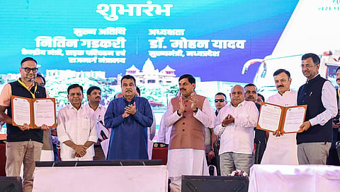 Union Minister Nitin Gadkari and Madhya Pradesh Chief Minister Mohan Yadav witness an MoU signing during the launch of Mukhyamantri Sugam Parivahan Seva and PM-eBus Seva at Bharat Heavy Electricals Limited (BHEL) Dussehra Ground, in Bhopal on Friday. 