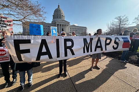 People opposed to new the U.S. House districts passed by the Missouri General Assembly demonstrate outside the state Capitol in Jefferson City, Mo., on March 10, 2026.