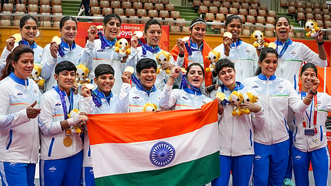 Indian players hold national tricolour flag as they pose for photographs after winning Gold medal in the women's  final Kabaddi match against Iran in the ongoing 20th Asian Games, in Tokai City, Japan, Saturday, Sept. 26, 2026.