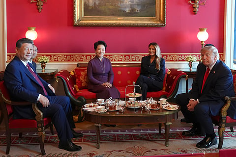 President Donald Trump, from right, and first lady Melania Trump attend a tea with China's President Xi Jinping, from left, and his wife Peng Liyuan in the Red Room of the White House, Friday, Sept. 25, 2026, in Washington. 
