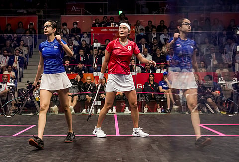 Anahat Singh (L) celebrates a point against Satomi Watanabe on Saturday