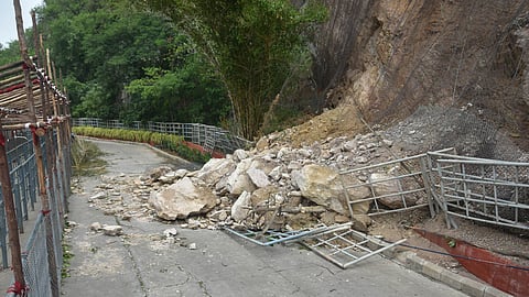 Due to continuous rainfall from the past two days, boulders fell on the ghat road leading to Indrakeladri Hill where Kanaka Durga Temple is located in Vijayawada on Friday.