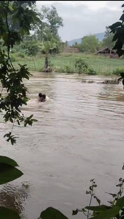 A thin cable stretched across the swollen Seethapalli stream has become the only lifeline for more than 200 tribal families living in the villages of Velagapalli and Gumpenapalli. 