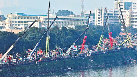 Idols of lord Ganesha are seen waiting in a long queue at Tankbund Road for immersion in the Hussainsagar in Hyderabad on Saturday. 