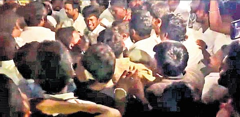 Residents and TVK members engaging in a scuffle during Minister V Sampath Kumar’s campaigning in Dharapuram on Friday night 