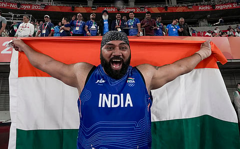 Tajinderpal Singh Toor celebrates after the shotput final