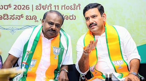 (L-R) Union minister HD Kumaraswamy with BJP state chief BY Vijayendra at a committee meeting between the BJP and JD(S) in Bengaluru on Saturday.