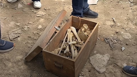 Suspected skeletal or bone material was found assembled inside an old wooden box