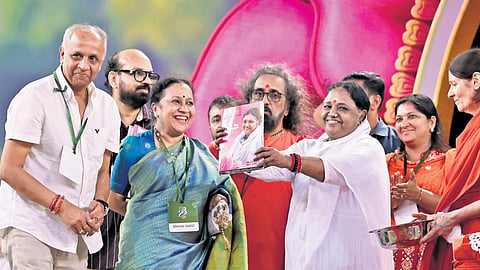 Mata Amritanandamayi Devi releasing ‘Amma Speaks’, a compilation of her
articles published in The Sunday Magazine, at a function held at Amritapuri in Kollam on Saturday. TNIE CMD Manoj Kumar Sonthalia, CEO Lakshmi Menon, 
general manager Kerala and head - special publications P Vishnukumar and 
Swami Amritaswarupananda Puri are also seen.