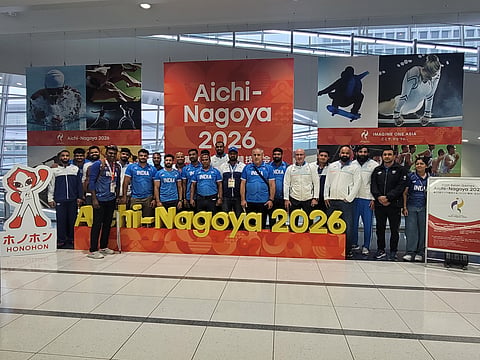 Indian wrestling contingent pose for a picture after reaching Nagoya on Sunday