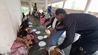 Cooked food being served to affected people in Kalahandi 