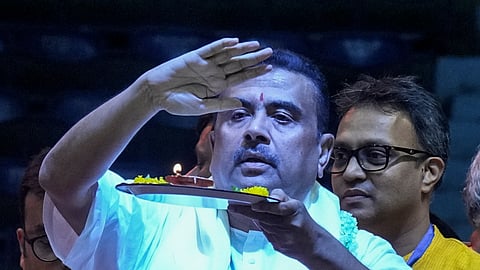 West Bengal Chief Minister Suvendu Adhikari offers prayers during the grand mass recitation of the Bhagavad Gita by 11,000 participants, at Netaji Indoor Stadium, in Kolkata, West Bengal, Sunday, Sept. 27, 2026.