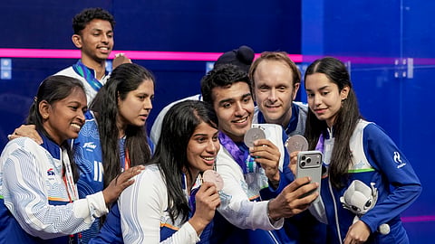 The Indian squash players pose for a selfie with their medals