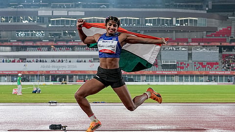 Ancy Sojan celebrates after the long jump final