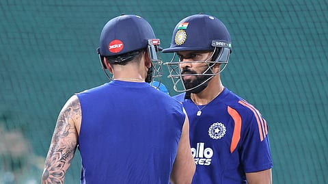 Virat Kohli (left, seen from behind) talks to Ruturaj Gaikwad during a net practice session at the Greenfield International Stadium in Thiruvananthapuram on September 26th.