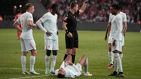 France's Kylian Mbappe lieas on the ground after he scored and injured himself during the UEFA Nations League soccer match between Turkey and France in Izmit, Turkey, Friday, Sept. 25, 2026.