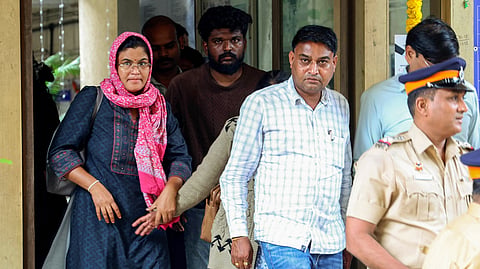 In this photo from Sept. 19, 2026, parents of 22-year-old Sahil Wakode, a second-year B.Tech student at IIT Bombay, arrive at the Powai Police Station in Mumbai. 