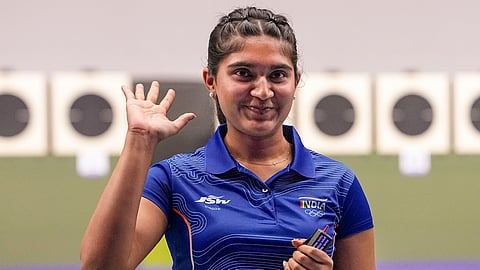 India's Esha Singh, left, greets after securing a silver medal during the women's 25m pistol event in the ongoing 20th Asian Games, at the Aichi Prefectural Shooting Range in Nagoya, Aichi Prefecture, Japan, Monday, Sept. 28, 2026.