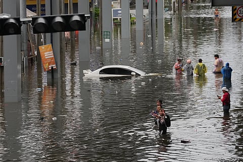 Streets are flooded after heavy rain in Bangkok, Thailand, Sunday, Sept. 27, 2026.