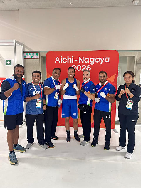 Lovlina Borgohain (c) with the coaches and support staff members after her win on Monday