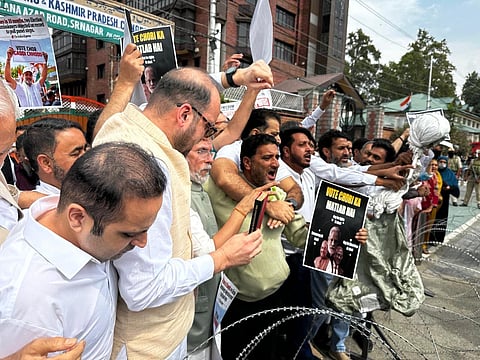 Police stopped the protesters outside the Congress office and prevented them from moving beyond the barricades.