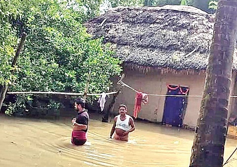 Residents in a flooded village of Bhadrak district on Sunday 