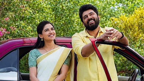 Mamitha Baiju (L) and Nivin Pauly (R) in Bethlehem Kudumba Unit