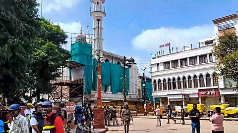 Security personnel keep vigil following stone-pelting incidents during protests against the proposed removal of a portion of the 'Shahi Masjid' for road widening, in Ujjain, Madhya Pradesh, Monday, Sept. 28, 2026