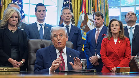 US President Donald Trump speaks during an event on fuel economy standards in the Oval Office of the White House, Dec. 3, 2025, in Washington.