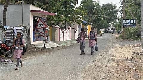 With no government bus operating through Nambiyar Nagar, roughly 500 students trudge to schools carrying heavy bags 