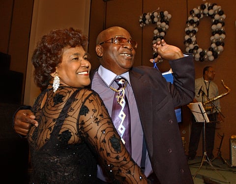 Calypso star, Slinger Francisco, otherwise known as 'The Mighty Sparrow,' right, celebrates his 70th birthday dancing calypso with Caribbean community leader Jean Alexander at a reception in his honor in the Brooklyn borough of New York, July 29, 2005