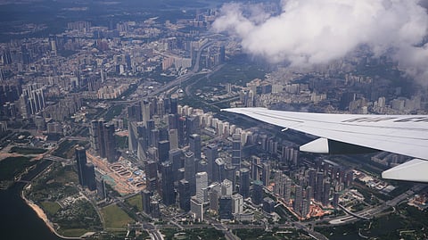 An Air China passenger plane flies over Shenzhen in southern China's Guangdong province on Monday, Sept. 28, 2026.
