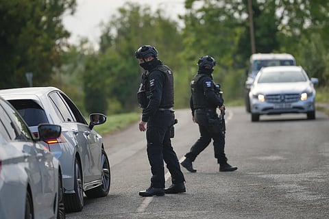 Police guard a road leading to RAF Fairford, in Fairford, England, Monday, Sept. 28, 2026. 