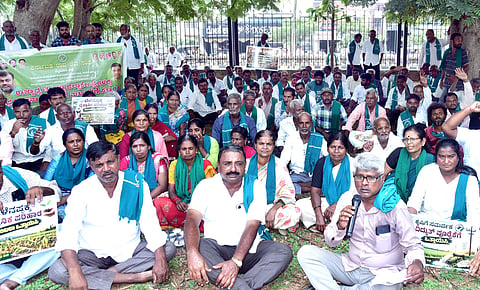 KRRS activists protest against Central and State governments alleging that they failed to support farmers reeling under drought in Mysuru on Monday  