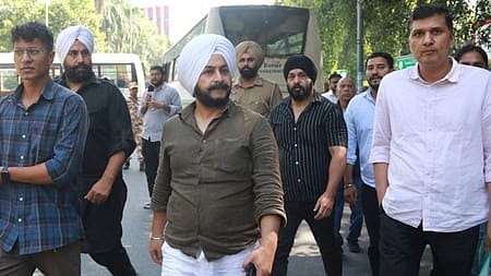 AAP leaders Saurabh Bhardwaj (right) and Jarnail Singh (centre).
