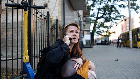 A woman reacts after a Russian drone strike on central Kyiv, Ukraine, Monday, Sept. 28, 2026.
