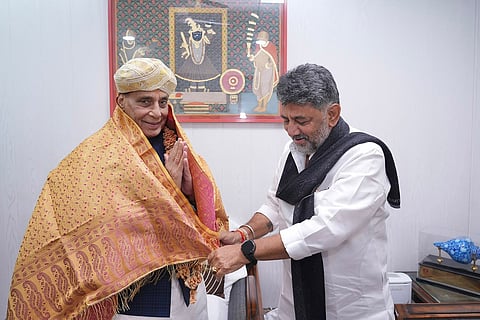 Chief Minister D K Shivakumar greets Defence Minister Rajnath Singh at the latter’s official residence in New Delhi on Monday.   