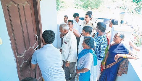 Officials escort the elderly couple home as per the collector’s orders in Nalgonda on Tuesday.