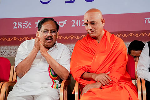 Deputy Chief Minister Dr G Parameshwara in conversation with Pontiff of Sri Adichunchanagiri Mutt Dr Niramalanandanatha Mahaswamiji in Bengaluru on Monday  