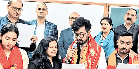 Woman enrols in MA to help son win University poll