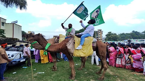 Adding a distinctive element to the protest, some workers arrived at the Lok Bhavan on camels.